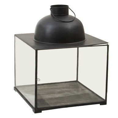 Small antique black metal lantern with clear glass panels and a domed top perfect for cozy lighting