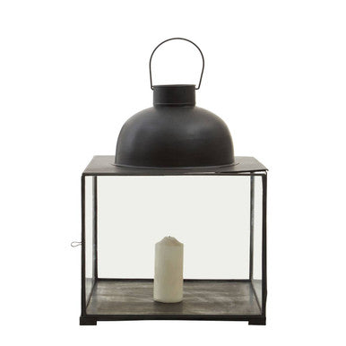 Small antique black metal lantern with glass enclosure and white candle inside Preston small antique black lantern