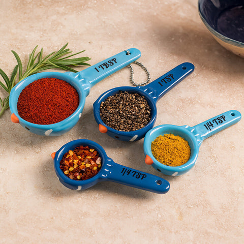 Set of three blue ceramic birdy measuring spoons with orange and white accents for precise cooking by pretty things