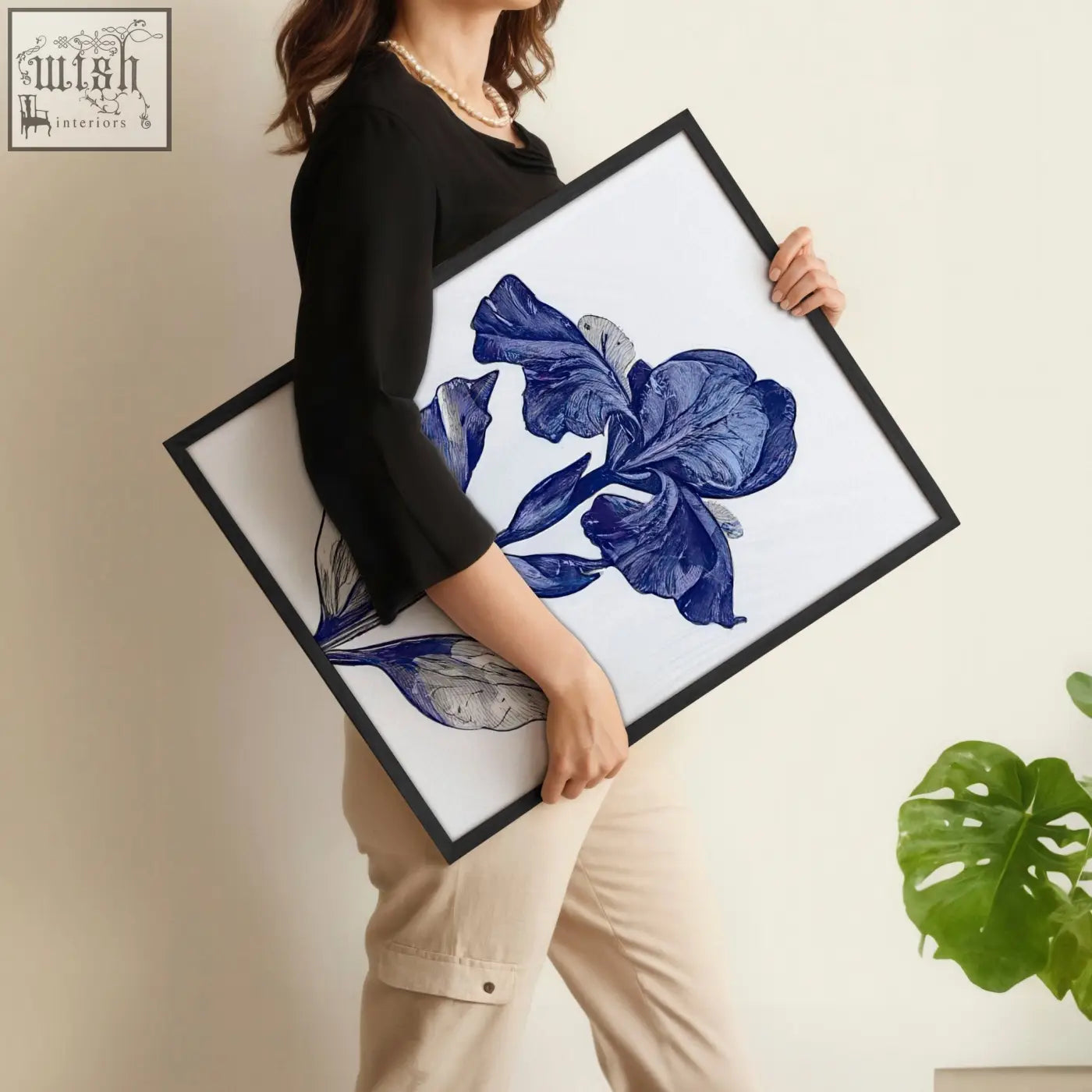 A framed botanical wall art print featuring a detailed blue iris illustration on white for bathroom decor