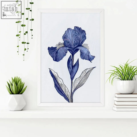 A framed blue iris botanical wall art print with fine line detailing in a minimalist white frame for bathroom decor