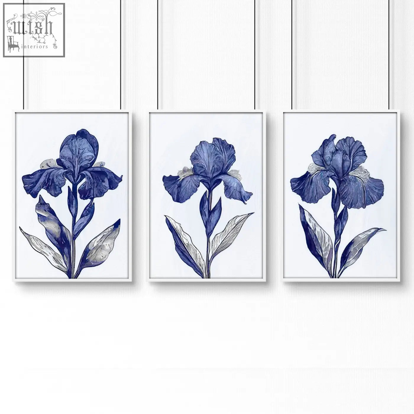 Set of three framed blue iris botanical wall art prints with white backgrounds and thin black hanging wires for bathroom