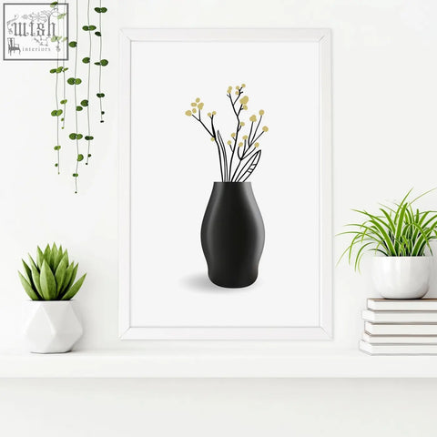 Black matte ceramic vase with slender stems and pale yellow blossoms in botanical wall art prints for bathroom walls