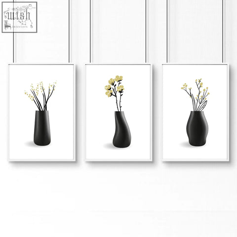 Set of 3 black ceramic vases with slender stems and yellow blossoms perfect for botanical wall art on bathroom walls