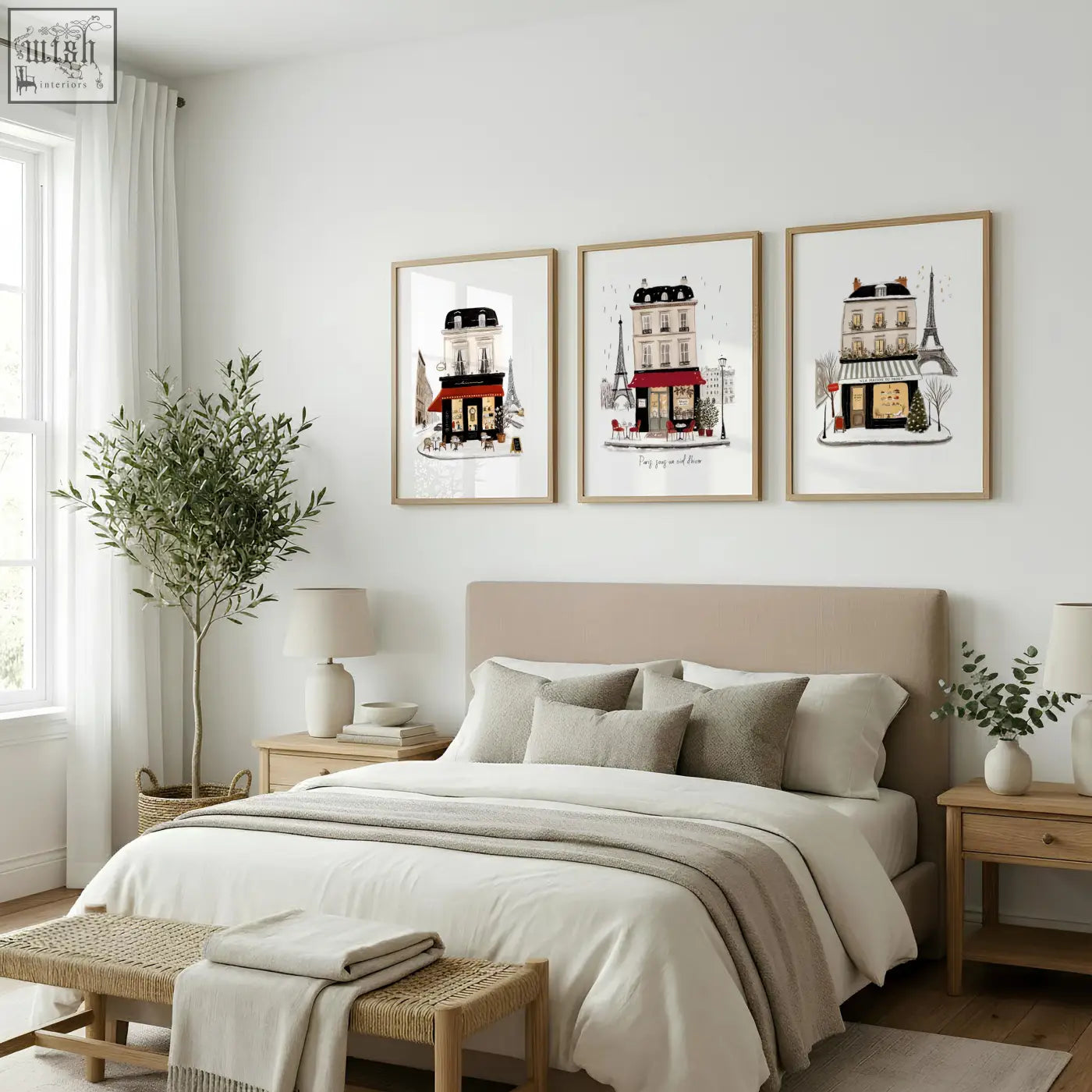 Three framed parisian street scene prints featuring maison du pain and paris sous designs hang on bedroom wall in white beige burgundy