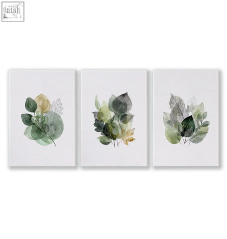 Set of three botanical canvas prints with layered green and gold leaves perfect for living room botanical decor