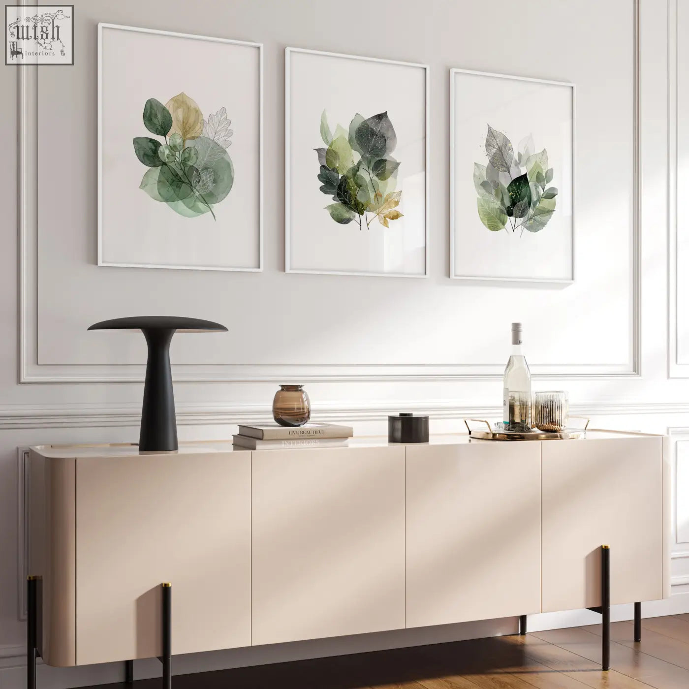 Cream-colored sideboard with sleek minimalist design and black legs paired with living room botanical green prints