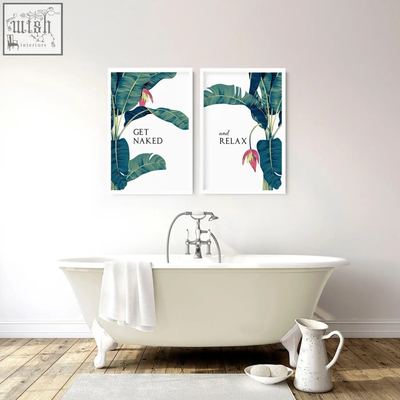 White clawfoot bathtub with chrome faucet and towel next to set of 2 tropical wall art for bathroom walls