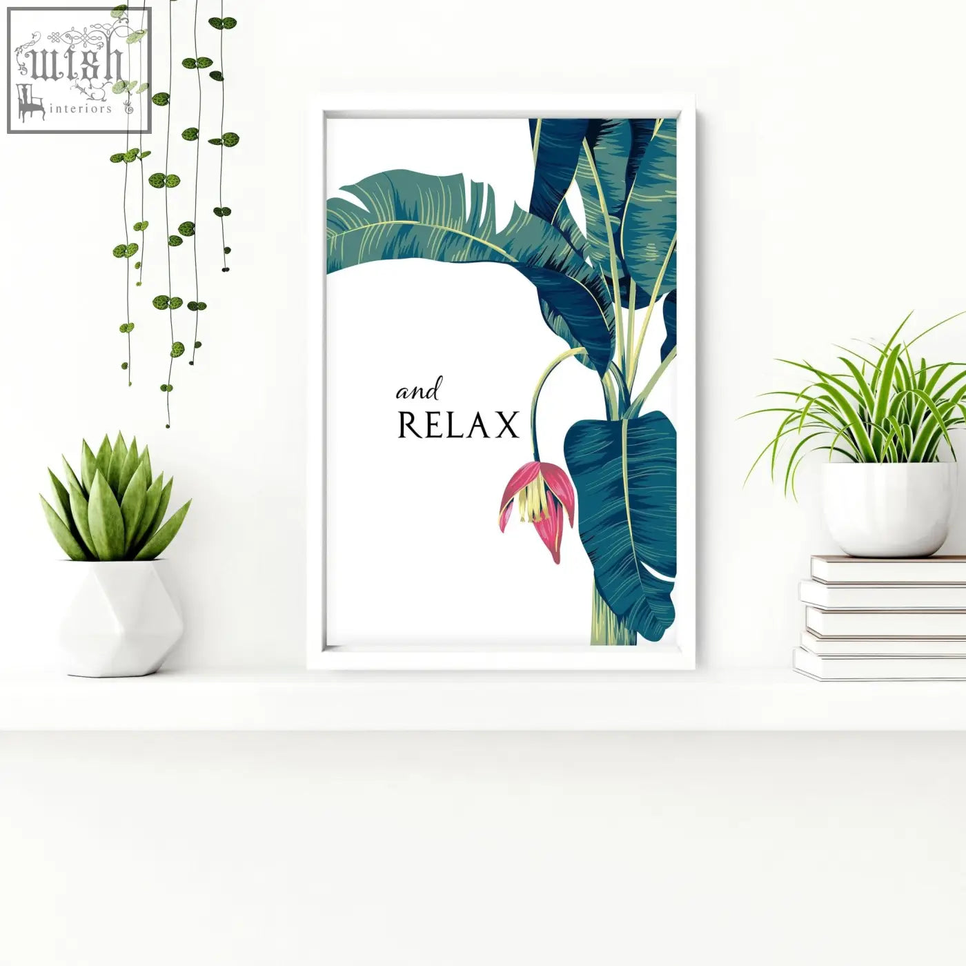 White framed tropical wall art with teal banana leaf pink blossoms and text and relax for bathroom walls set of 2