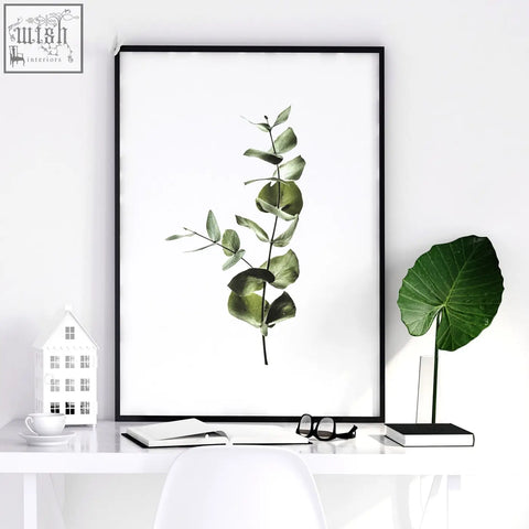 Black-framed wall art prints set of 2 featuring single eucalyptus branch with soft green leaves for kitchen decor