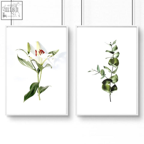 Set of 2 wall art prints featuring minimalist white lily and eucalyptus in white frames perfect for kitchen decor