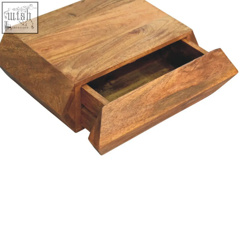 A prisma wall mounted unit chest of drawers with a rustic natural mango wood finish and visible grain patterns