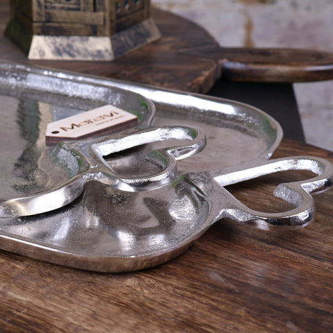 Silver hammered metal serving tray with ornate heart shaped handles from punji luxury serving trays set