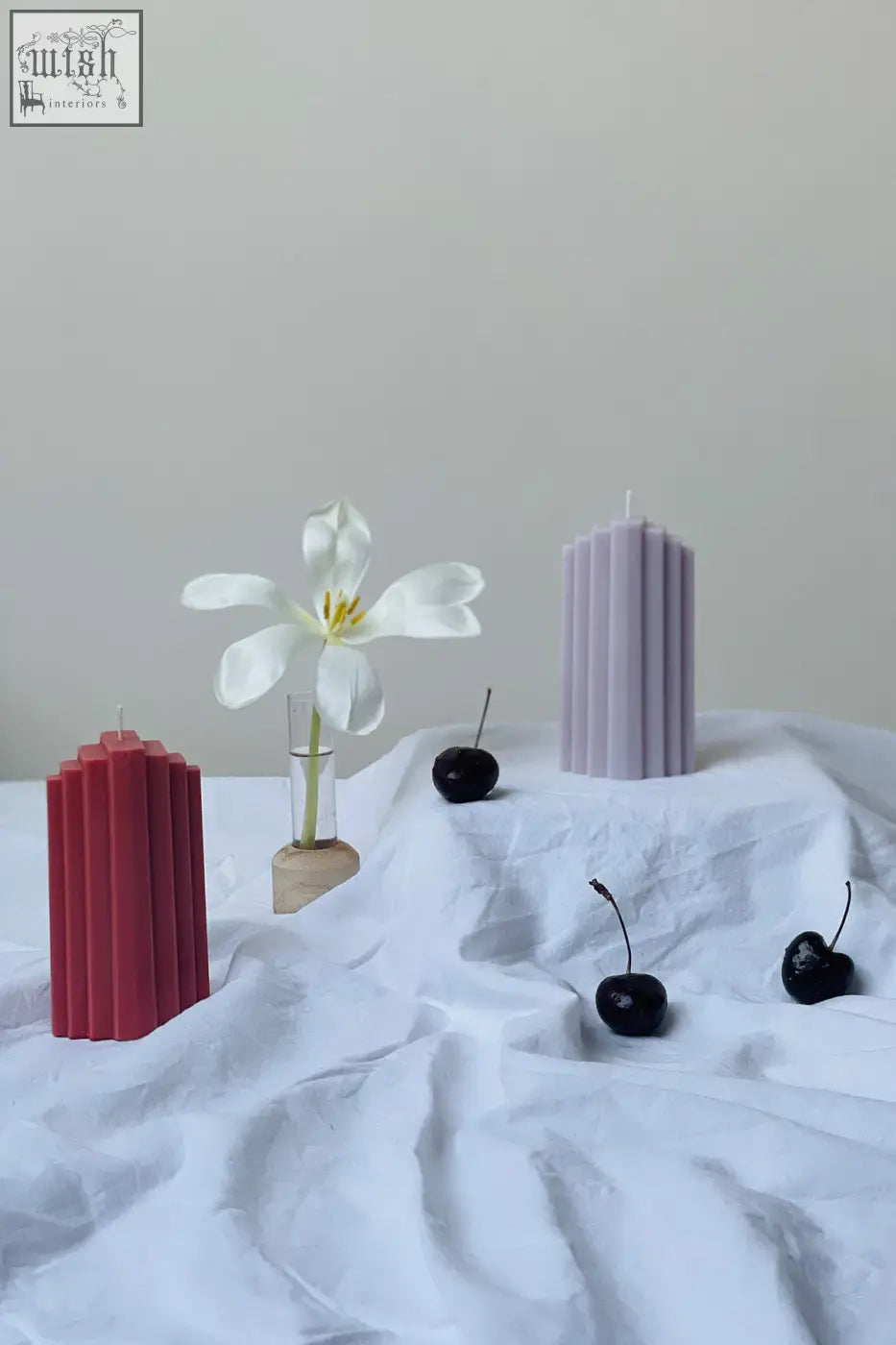 Pyramid sculpted candle with tall vertical ribs in a soft lavender color perfect for cozy decor