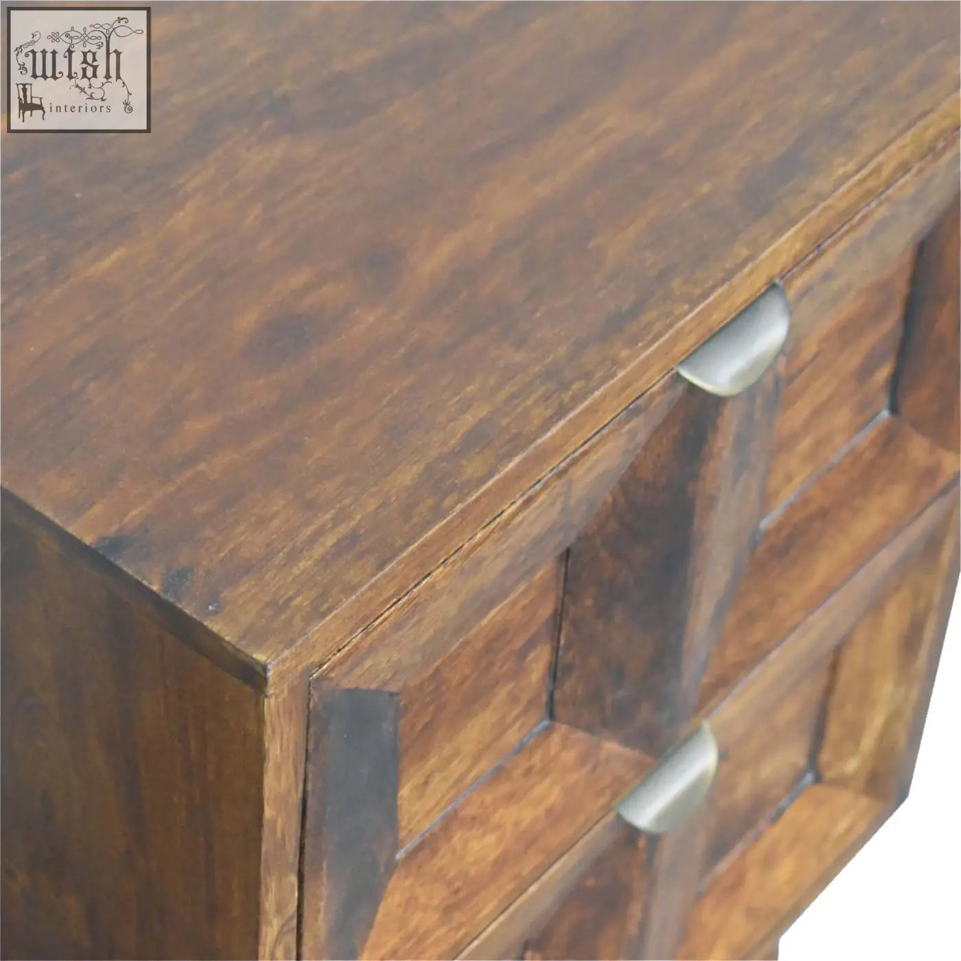 Dark brown quad bedside table made of solid mango wood with sleek silver drawer pulls for stylish storage