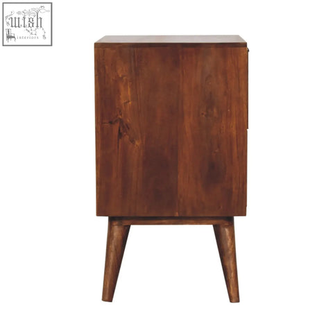 A mid-century modern quad bedside table made of solid mango wood with a warm brown finish and tapered legs