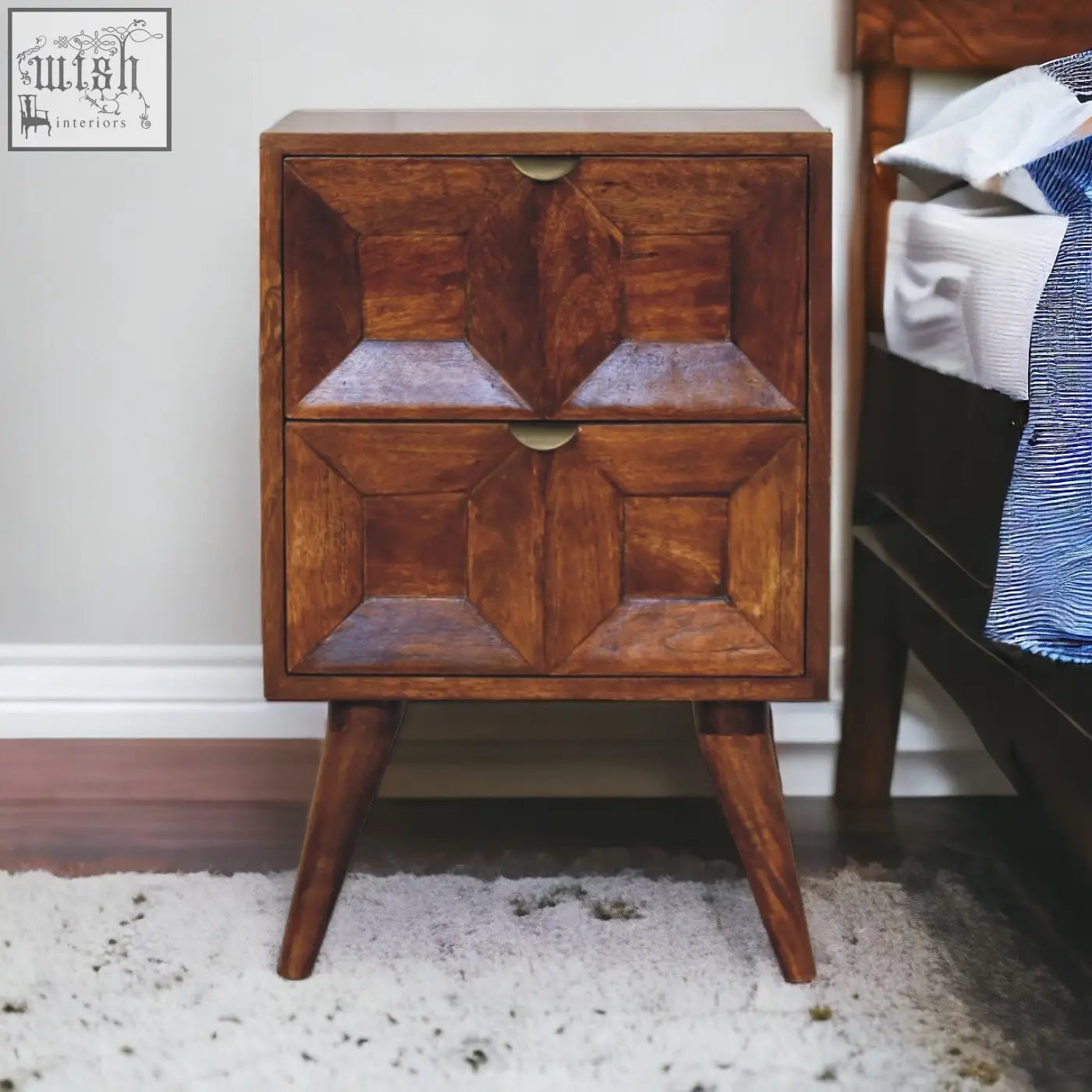 Warm brown quad bedside table made of solid mango wood with geometric inlay patterns and tapered legs