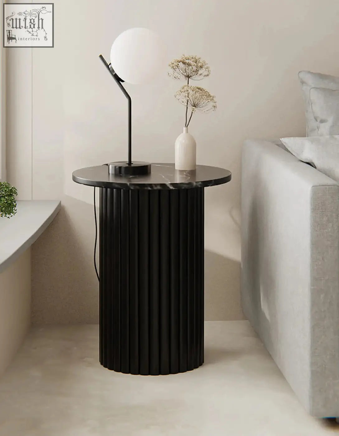 Qualls round side table with black marble surface and vertical fluted columns perfect for stylish living rooms offer financing