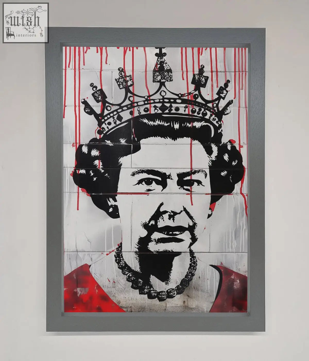 A framed black and white queen elizabeth graffiti poster with red drips wearing a crown and pearl necklace
