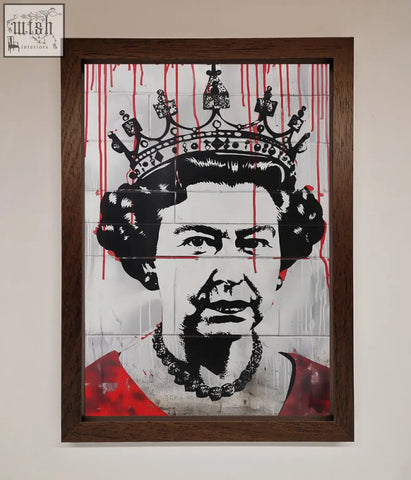 A framed queen elizabeth graffiti poster in bold black and white with striking elizabeth graffiti red blood drips on tiles