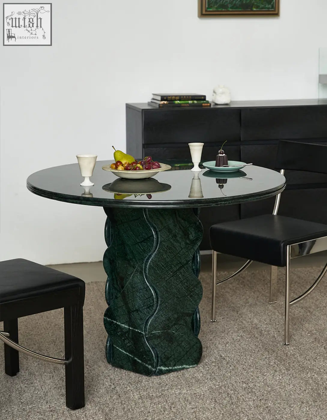 Quintero dining table round with dark green marble top and sculpted wavy pedestal base solid wood option available