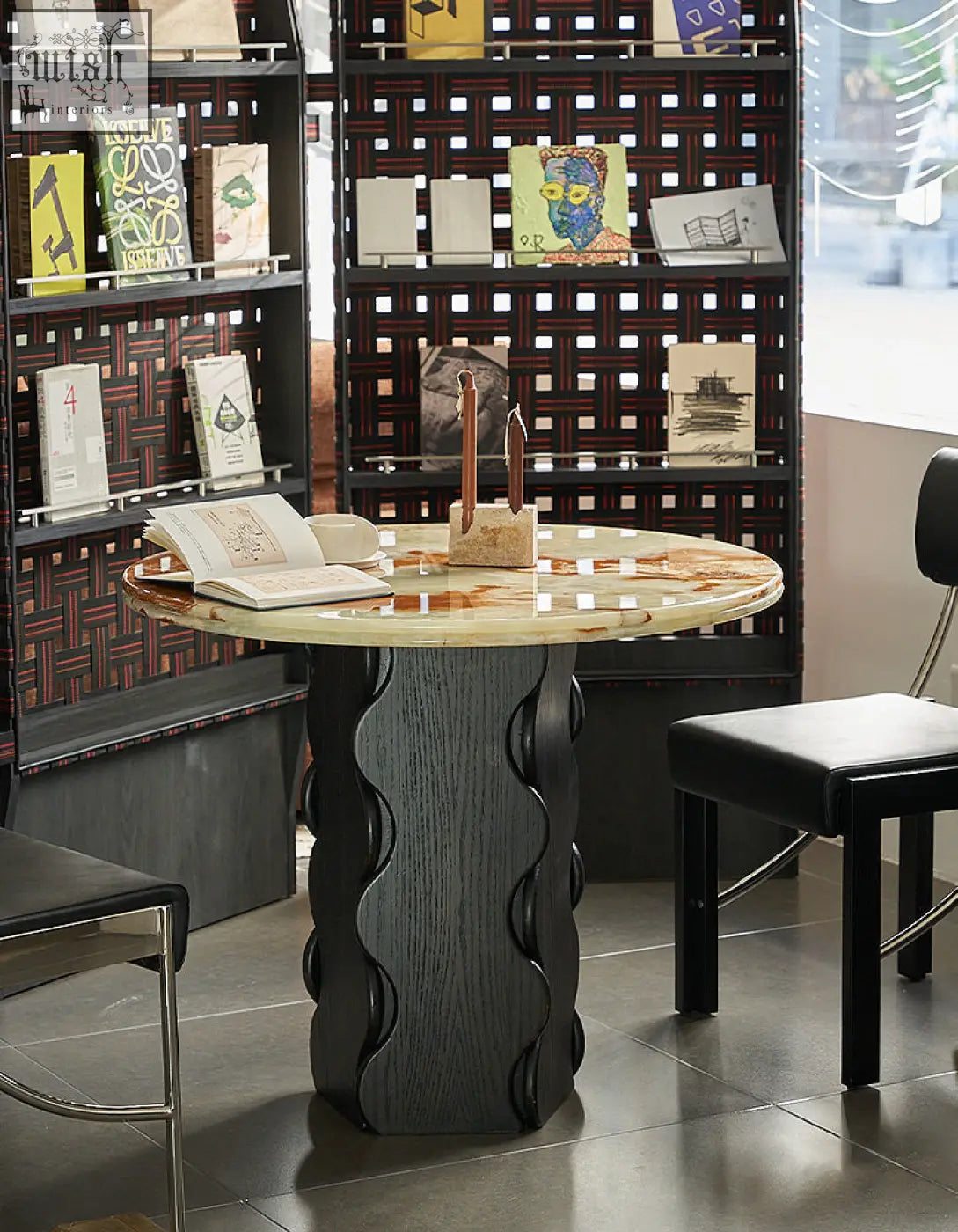 Quintero dining table round with a polished beige and brown round marble top and dark gray sculpted base perfect as dining table