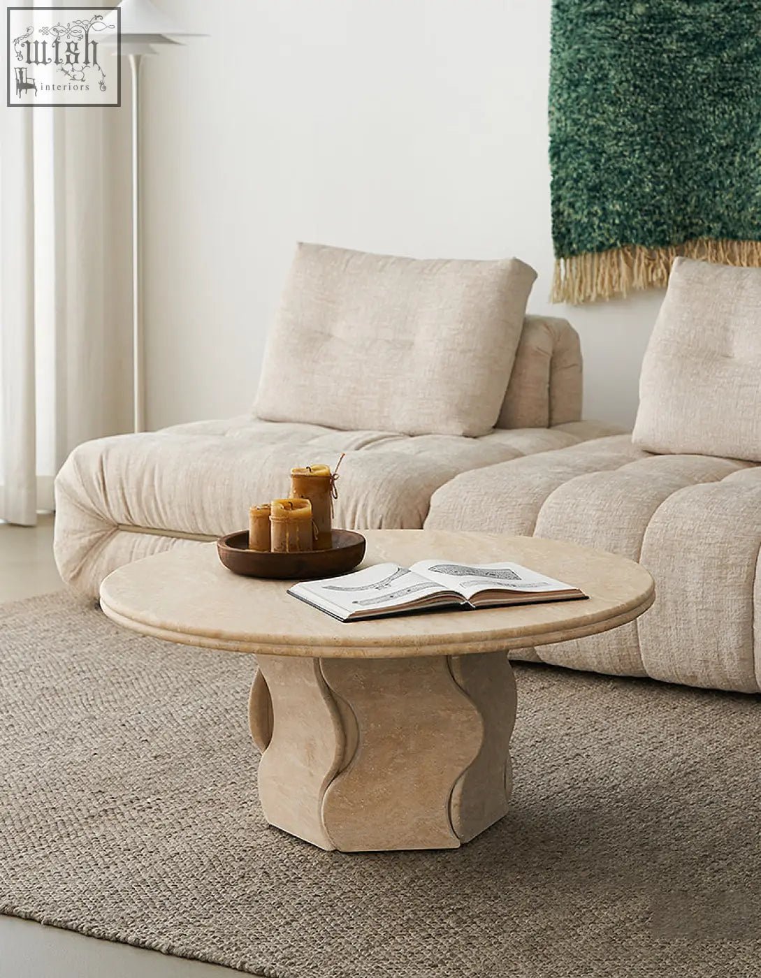 Beige quintero round coffee table with smooth rounded top and sculpted marble base perfect marble coffee table
