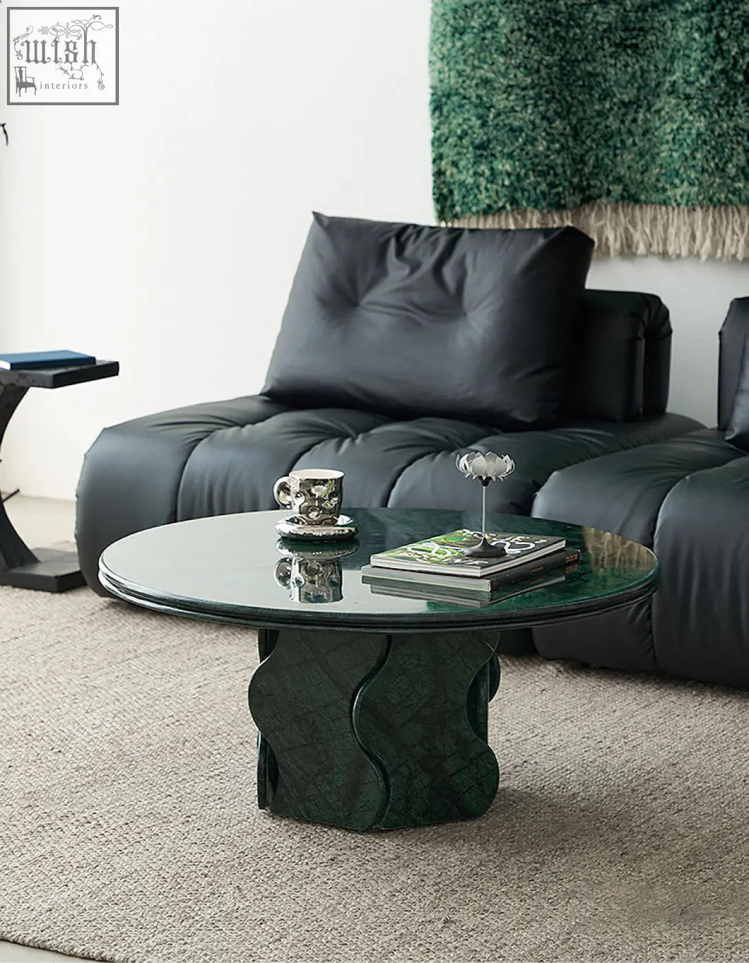 Quintero round coffee table with emerald green glass top and sculpted textured solid wood base ideal as a marble coffee table alternative