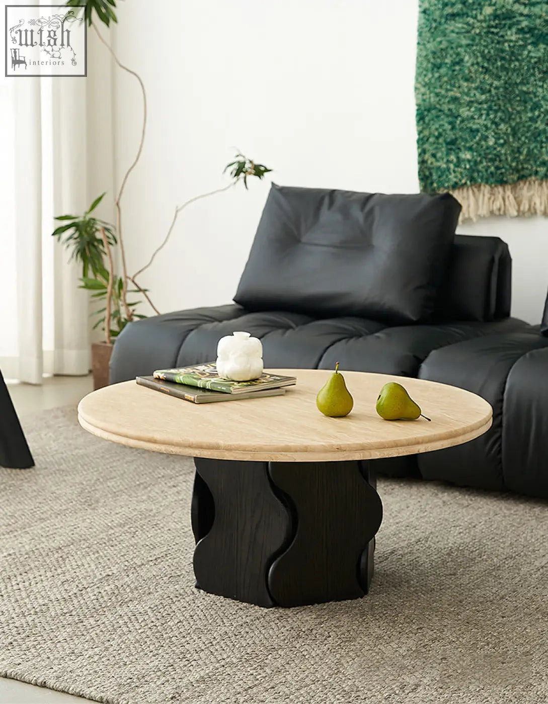 Quintero round coffee table with light solid wood top and black sculpted base perfect as a marble coffee table alternative
