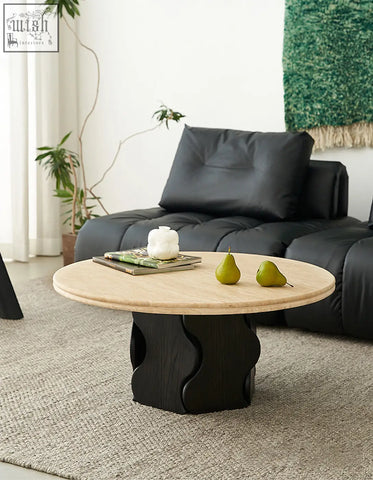Quintero round coffee table with light solid wood top and black sculpted base perfect as a marble coffee table alternative