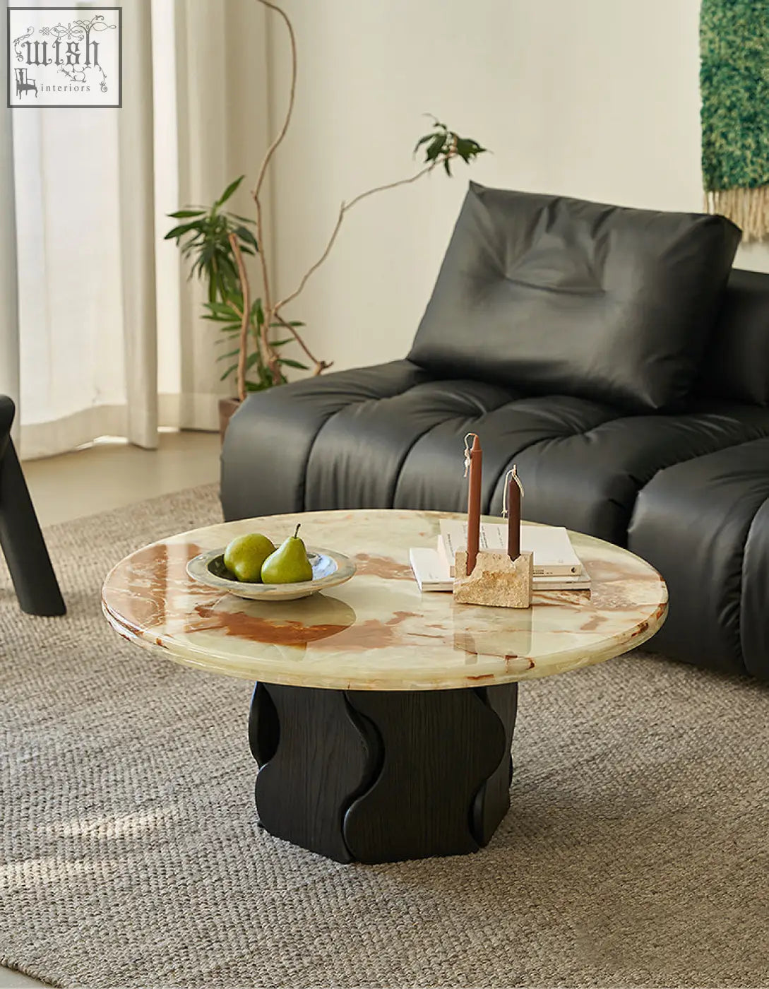 Quintero round coffee table with polished marble coffee table top in creamy beige and brown on sculpted black base