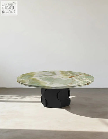 Quintero round coffee table with polished green marble top and sculpted black base solid wood marble coffee table