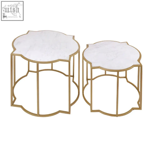 Rabia set of 2 tables with gold-toned metal frame, white marble tops, ornate scalloped edge, and openwork bases