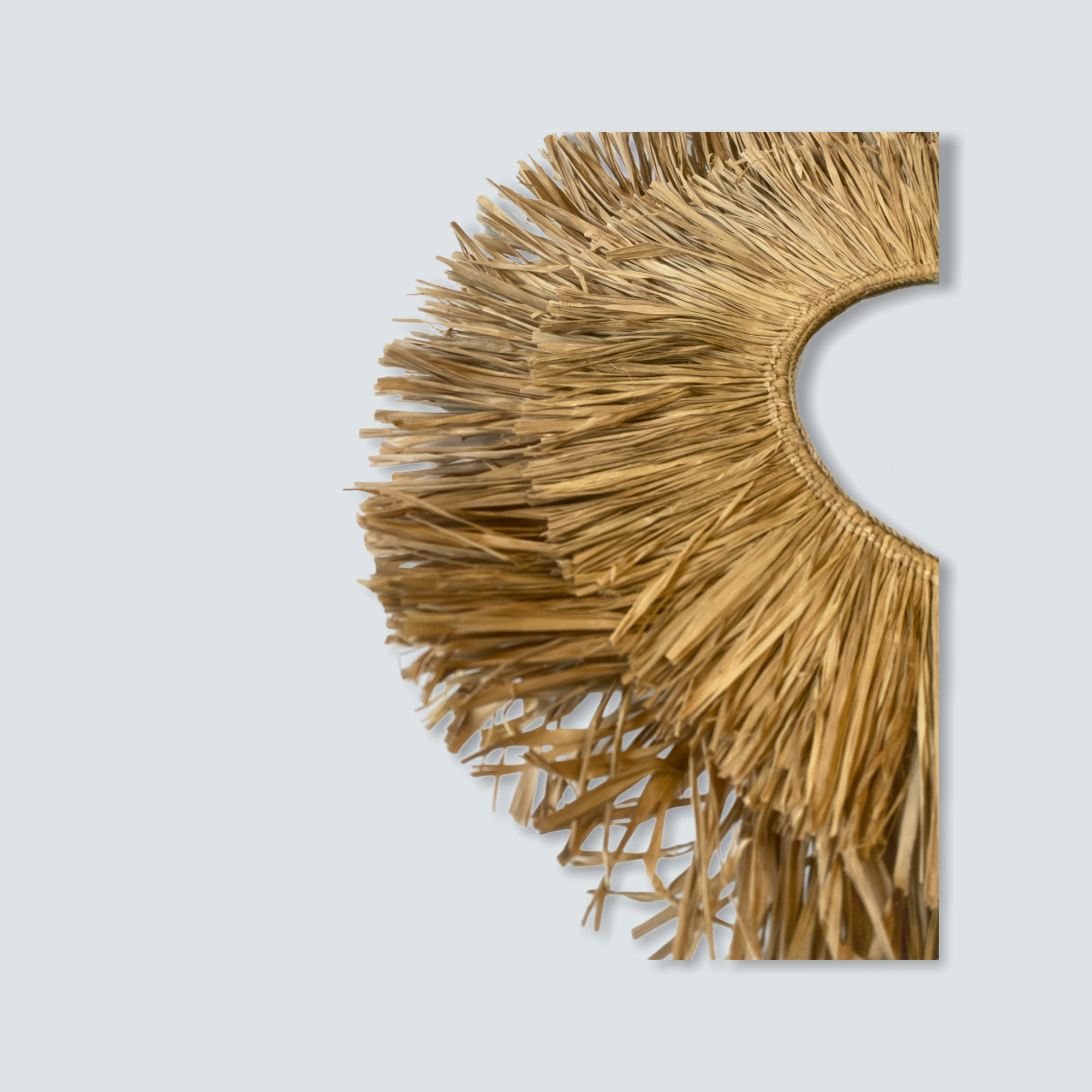 Raffia mirror m with golden straw fringe wall decor featuring a circular semi circular design