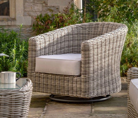 Gray woven wicker ragusa swivel chair with aluminium frame and light beige cushion for indoor outdoor use