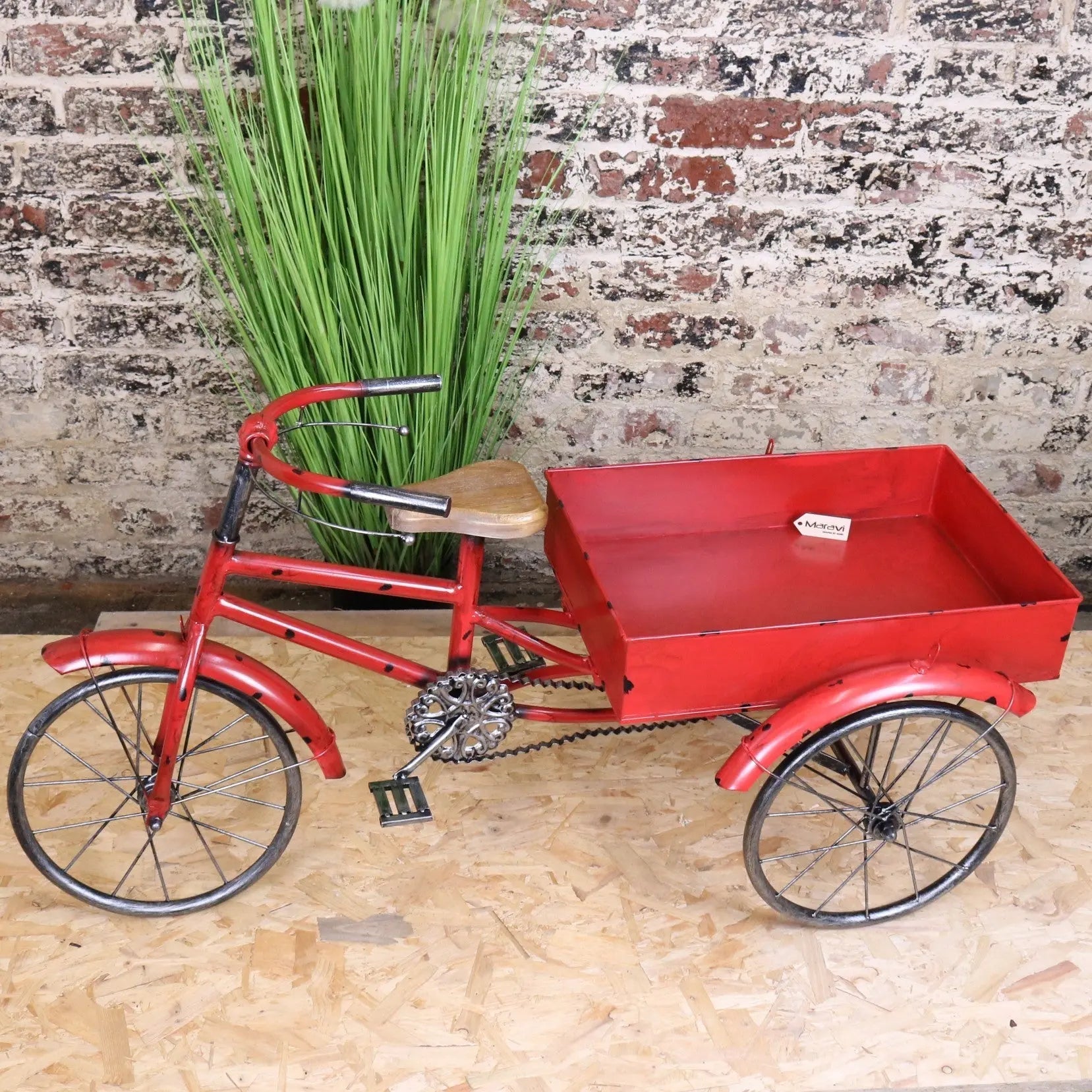 Red metal rahi vintage style tricycle ornament with wooden seat and black spoked wheels perfect for decor