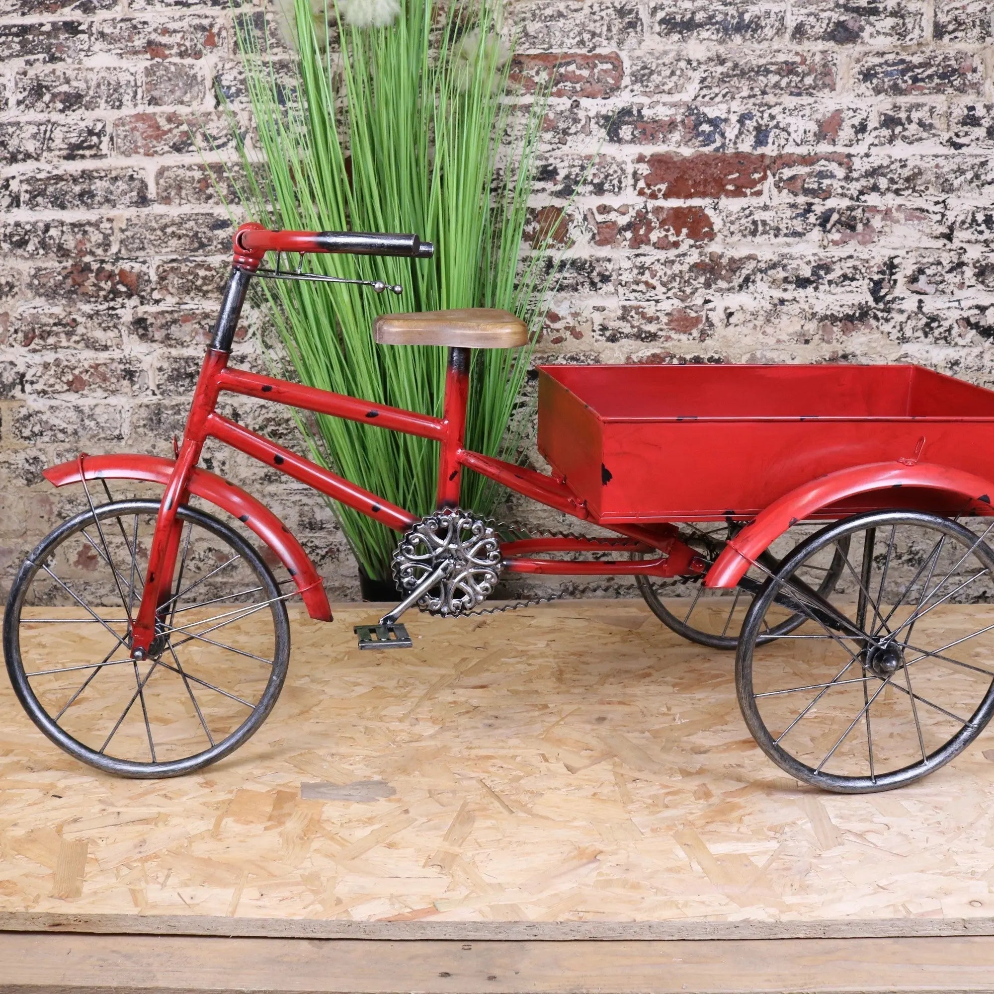 Red metal rahi vintage style tricycle ornament with wooden seat silver decorative gear and red cargo bed attached