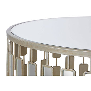Raina large round coffee table with a mirrored top and gold metal frame featuring vertical rectangular cutouts