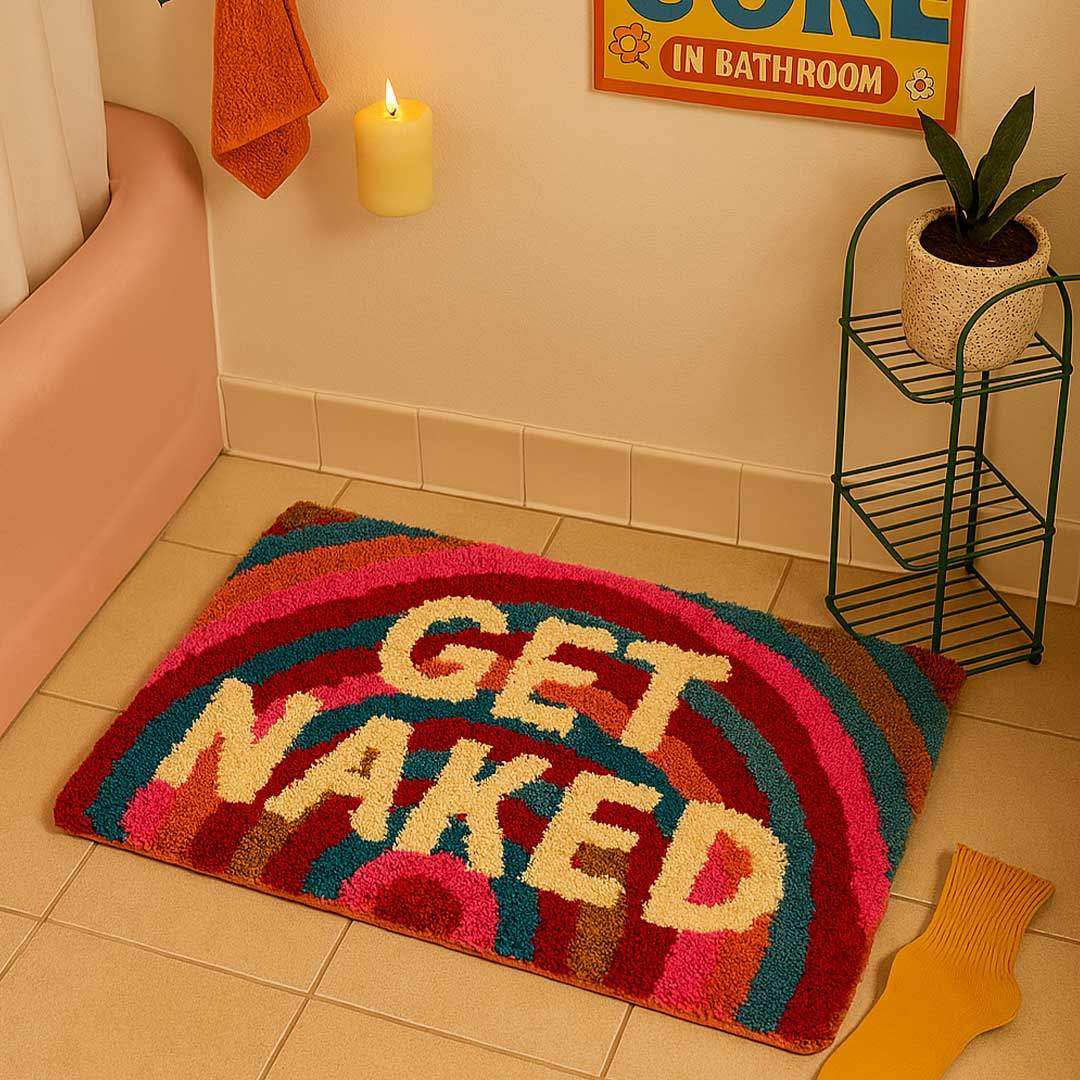 Colorful plush rainbow get naked bathmat with cream lettering perfect for adding fun to your bathroom floor