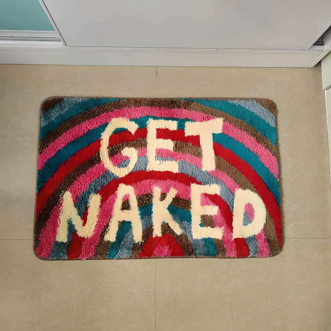 Colorful plush rainbow naked bathmat with bold stripes and cream get naked lettering for bathroom use