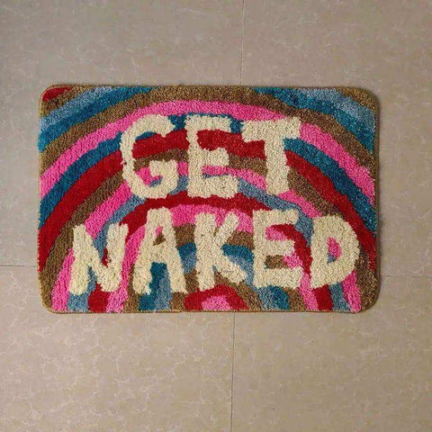 Colorful plush naked bathmat with get naked cream letters on rainbow pink red blue brown stripes for bathroom use