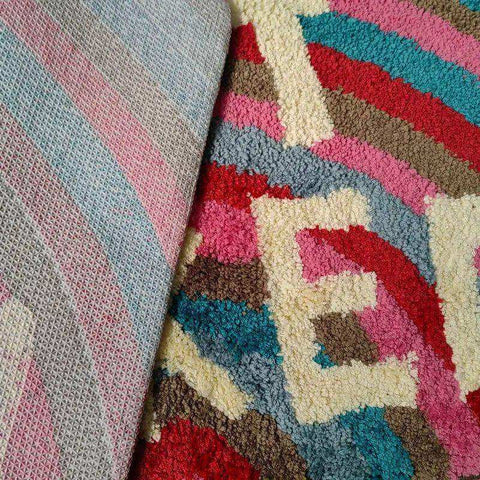 Rainbow get naked bathmat with a colorful plush geometric rug in pink red teal and beige for bathroom use