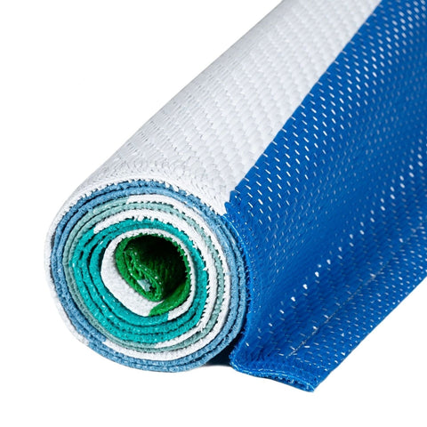 A rolled-up rainbow outdoor rug blue with vibrant woven stripes and a green inner layer perfect for outdoor use