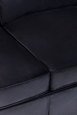 Black velvet sofa cushion from Ralph three seat velvet sofa with clean stitched edges and plush soft texture