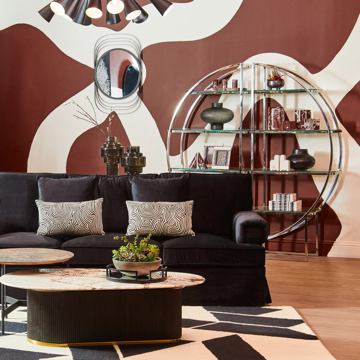 Ralph three seat black velvet sofa with geometric patterned throw pillows in sleek black velvet upholstery