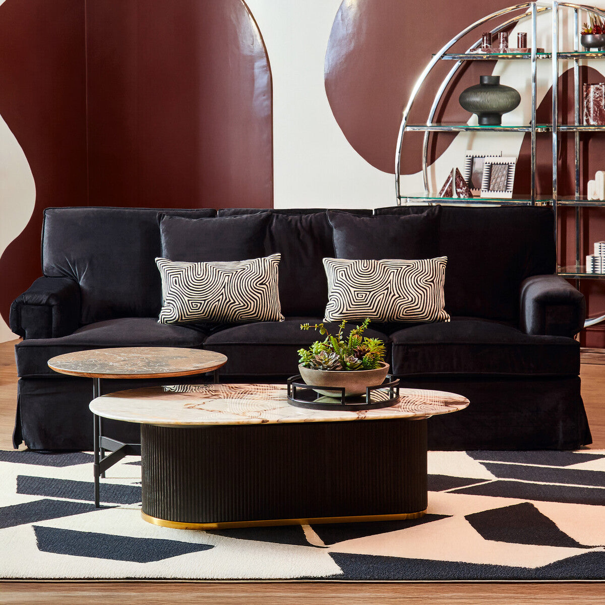 Ralph three seat black velvet sofa with two geometric patterned throw pillows for stylish living room seating