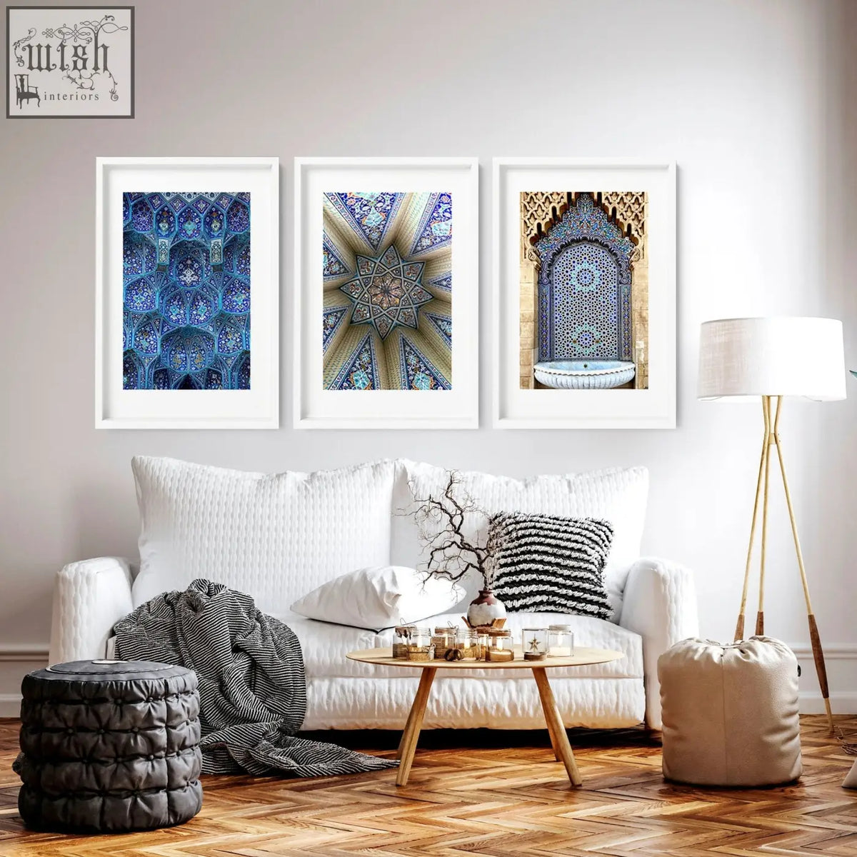 Three framed blue and gold islamic art prints hang above a white sofa perfect for ramadan decoration ideas wall art prints