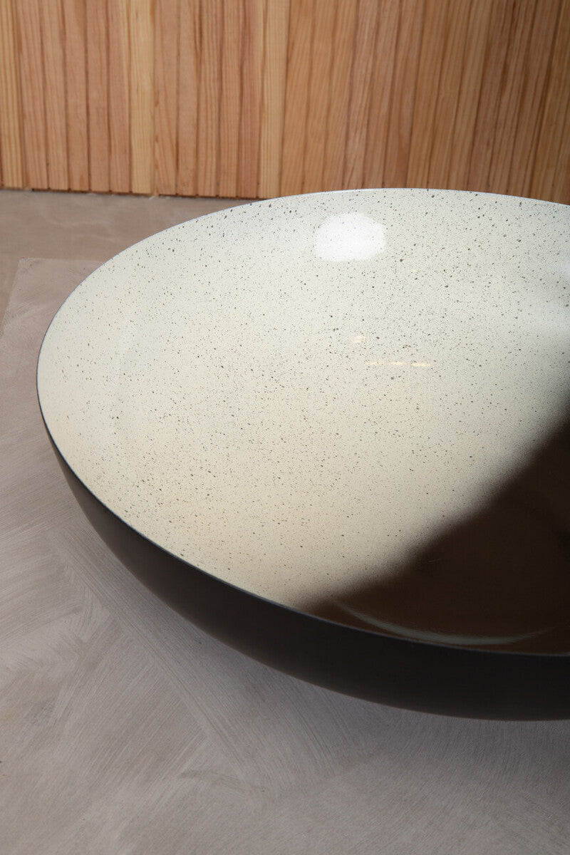 Cream-colored speckled ceramic ombre bowl with a glossy black rim perfect as a white ombre bowl vessel sink