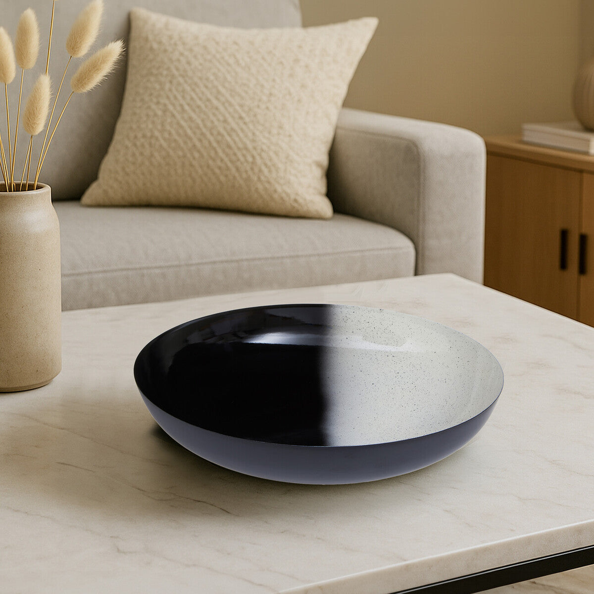 A sleek ceramic ramus black and white ombre bowl with a glossy black and matte gray two-tone finish