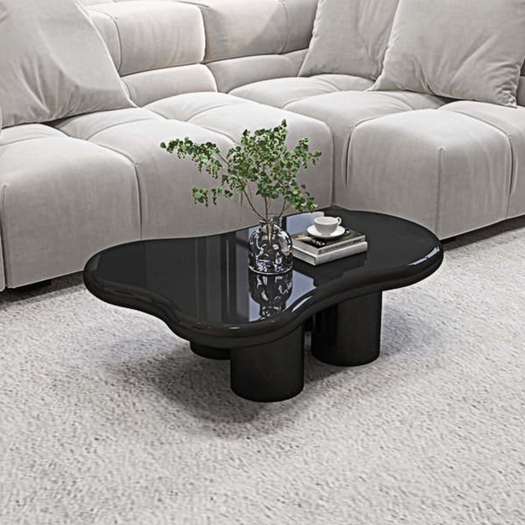 Black glossy ramy coffee table with organic cloud shape and cylindrical legs perfect for stylish living spaces